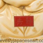 JAPANESE MEIJI PERIOD BOXWOOD NETSUKE OF A SEATED SENNIN - SIGNED