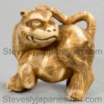 A JAPANESE STAG ANTLER TIGER NETSUKE