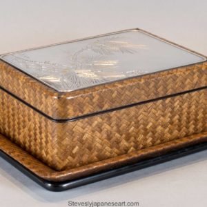 A JAPANESE SILVER MOUNTED AND BASKET WEAVE TRINKET BOX ON STAND