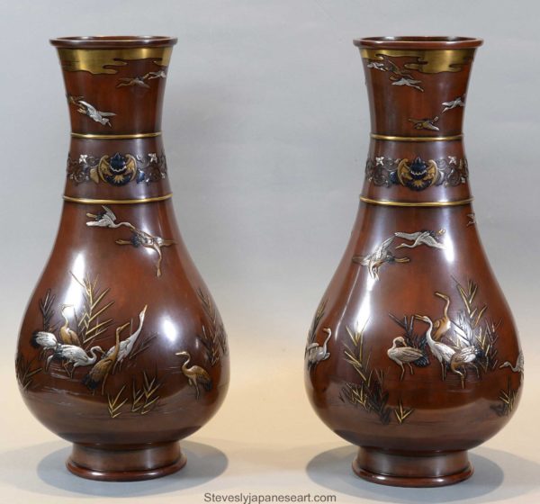 A HIGHLY DECORATIVE & FINE QUALITY PAIR OF JAPANESE BRONZE VASES BY NOGAWA