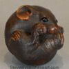 FINELY CARVED JAPANESE BOXWOOD NETSUKE OF A COILED RAT BY MASANAO