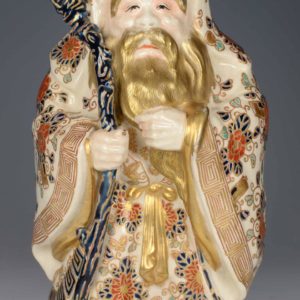 A JAPANESE IMPERIAL SATSUMA OKIMONO OF JUROJIN-GOD OF LONGEVITY