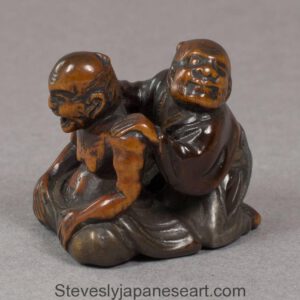 JAPANESE EDO PERIOD WOOD AND LACQUER NETSUKE OF THE BLIND MASSEUR