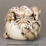 A DELIGHTFUL JAPANESE STAINED IVORY OKIMONO OF A RAT GROUP
