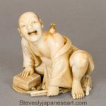 A FINE QUALITY JAPANESE MEIJI PERIOD IVORY OKIMONO OF A THWARTED RAT CATCHER