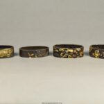 A NICE GROUP OF JAPANESE EDO PERIOD MIXED METAL FUCHI (SWORD FITTINGS)